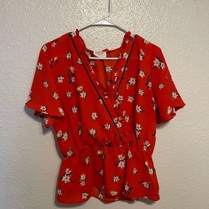 Red top, white flowers